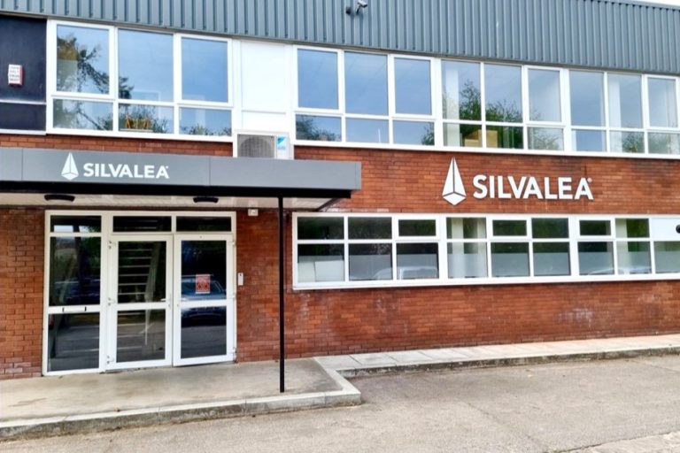 Red brick building with the Silvalea logo emblazoned on the brick and grey awning.