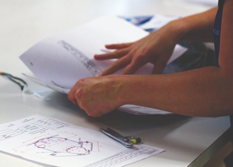 Woman referring to pattern for a Silvalea sling